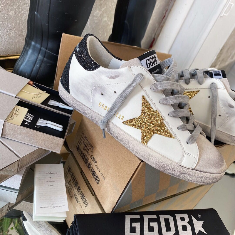 golden goose men’s S*per-star sneakers with golden glitter and black heel tab