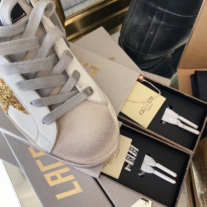 golden goose men’s S*per-star sneakers with golden glitter and black heel tab