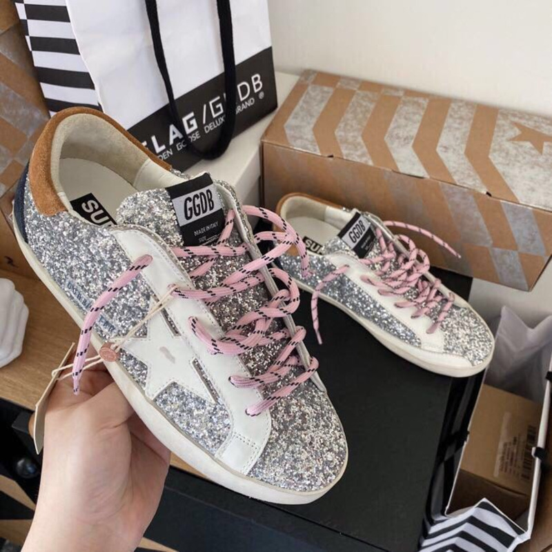 golden goose men’s S*per-star sneakers with sliver glitter and brown heel tab
