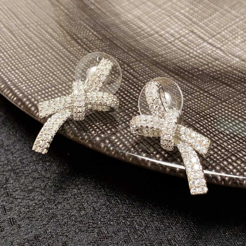 ch*el bow tie sparkling Di*m*nd earrings