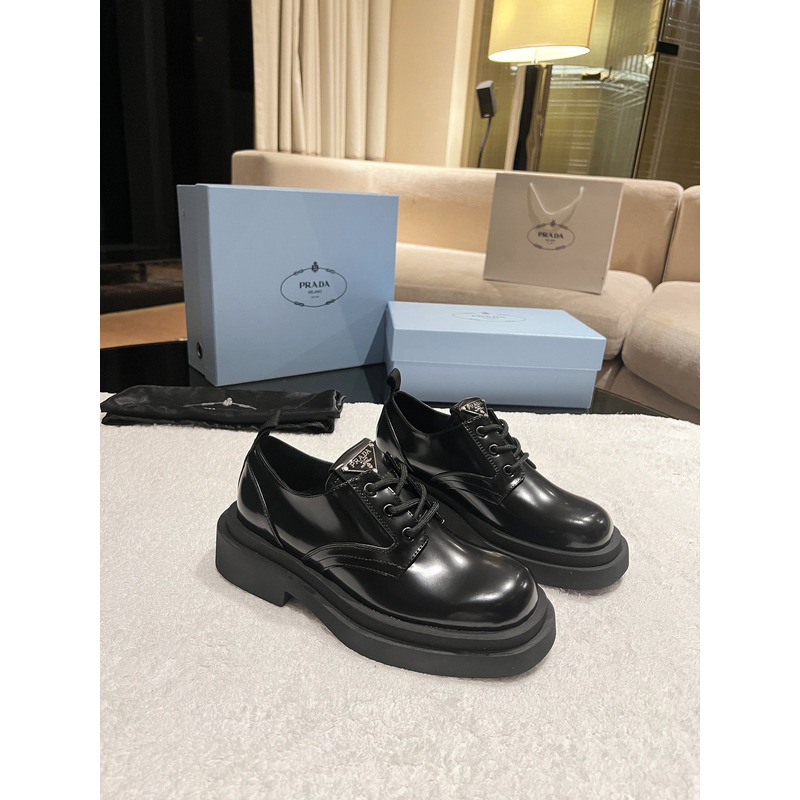 Pra*a triangle-logo brushed leather derby shoes black